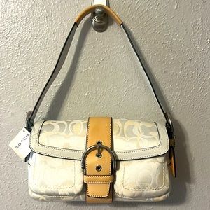 Beautiful small Coach purse.  New w/ tags and dust bag.